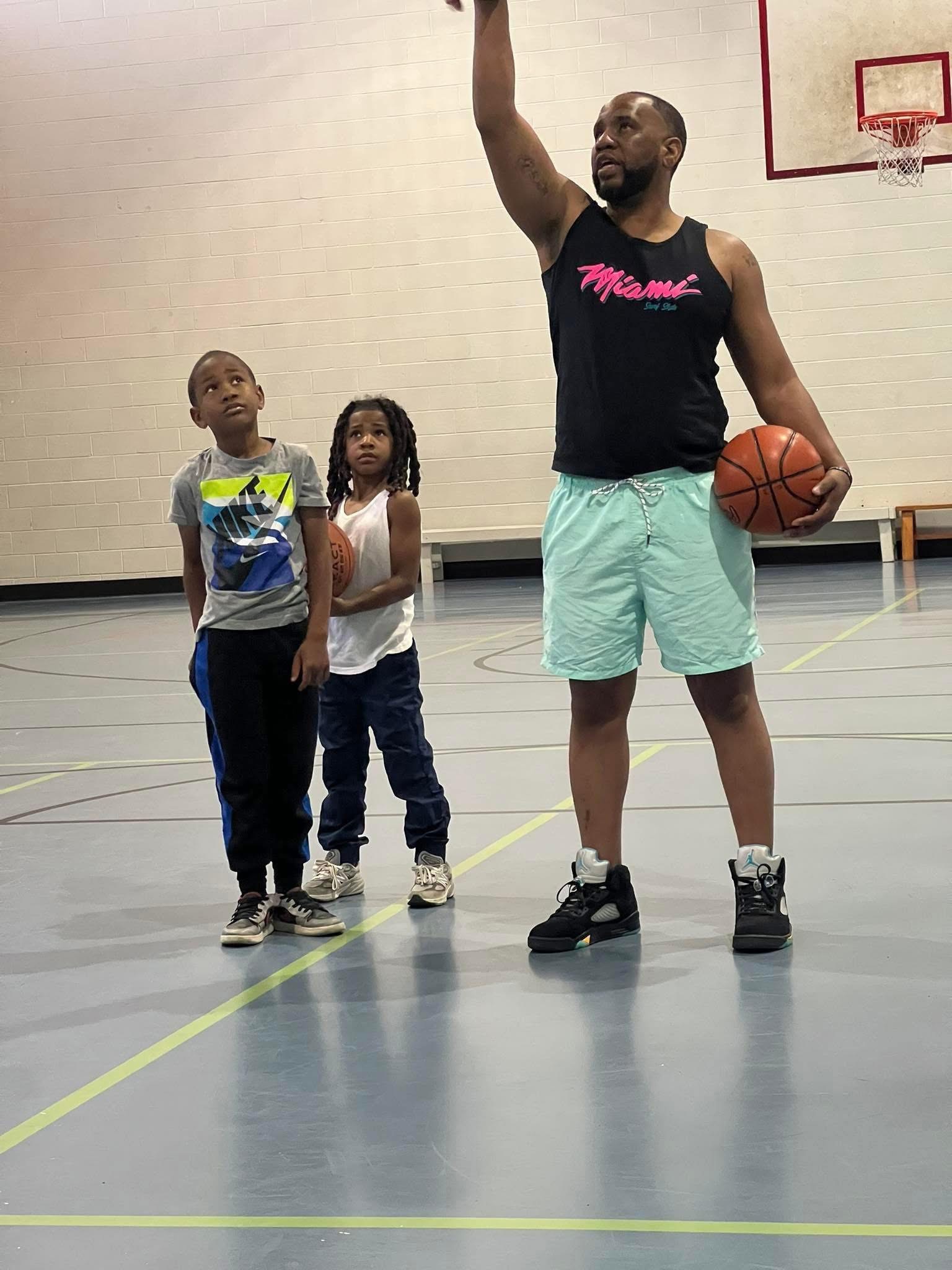 Coach Coop helping Avery